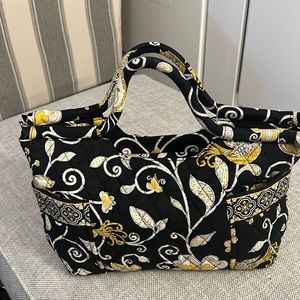 Vera Bradley black and yellow zipper hand bag 2 exterior pockets. Barely used.